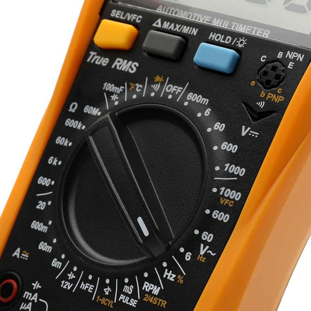Close-up detail of the GEARWRENCH GWDM107 automotive multimeter selection dial, highlighting the various measurement settings, True RMS label, and rubberized function buttons.
