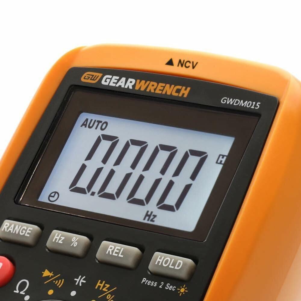 Close-up of GEARWRENCH multimeter rotary selector switch and function buttons, showing various electrical measurement settings including voltage, resistance, and frequency.