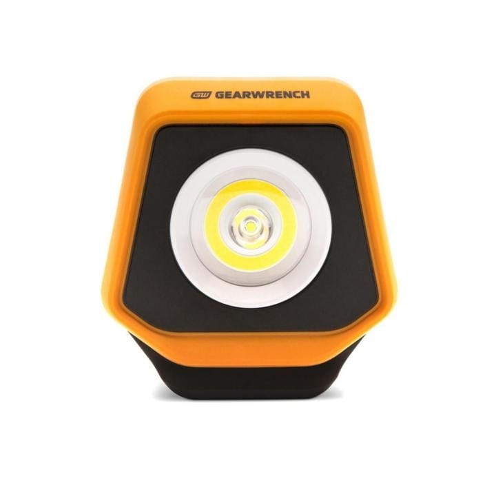 GearWrench LED shop light with orange casing, black accents, and central LED surrounded by concentric rings, designed for focused lighting in professional work areas.