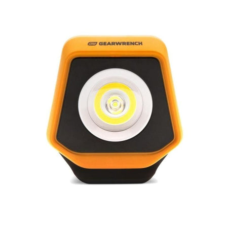 GearWrench LED shop light with orange casing, black accents, and central LED surrounded by concentric rings, designed for focused lighting in professional work areas.
