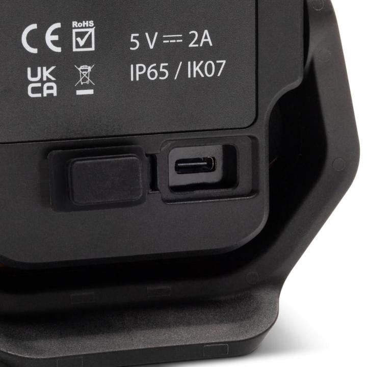 Close-up of GearWrench shop light’s USB-C charging port and printed specifications including IP65 and IK07 ratings, CE and RoHS certifications, and 5V 2A power input