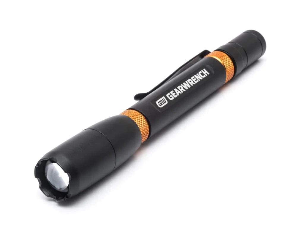 GearWrench pen-style inspection light with black body, orange grip accents, and pocket clip, designed for precision lighting in tight spaces.