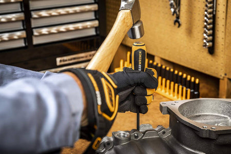 Close-up demonstration of the GearWrench 86092 impact screwdriver being used with a ball-peen hammer to apply striking force for loosening rusted hardware.