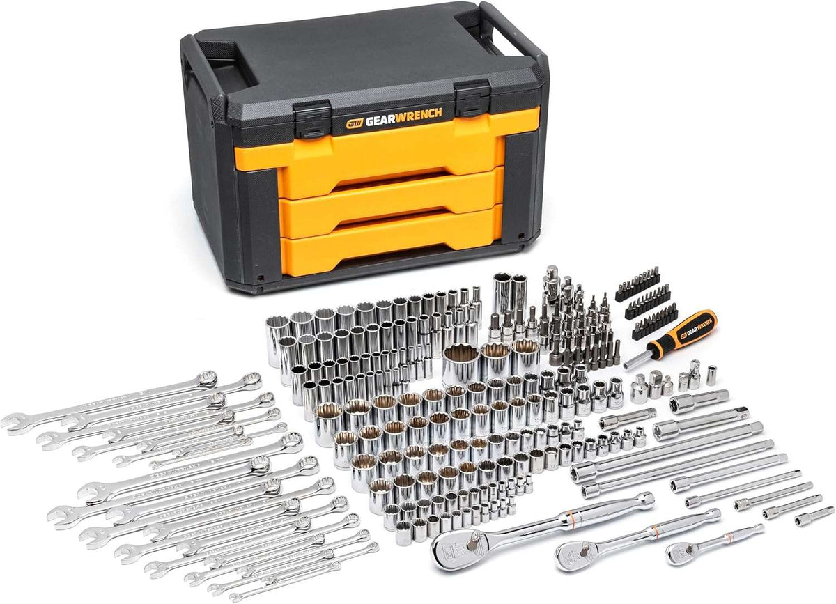 A studio shot of the entire 243-piece GEARWRENCH mechanics tool set laid out in front of its closed 3-drawer black and yellow storage box.