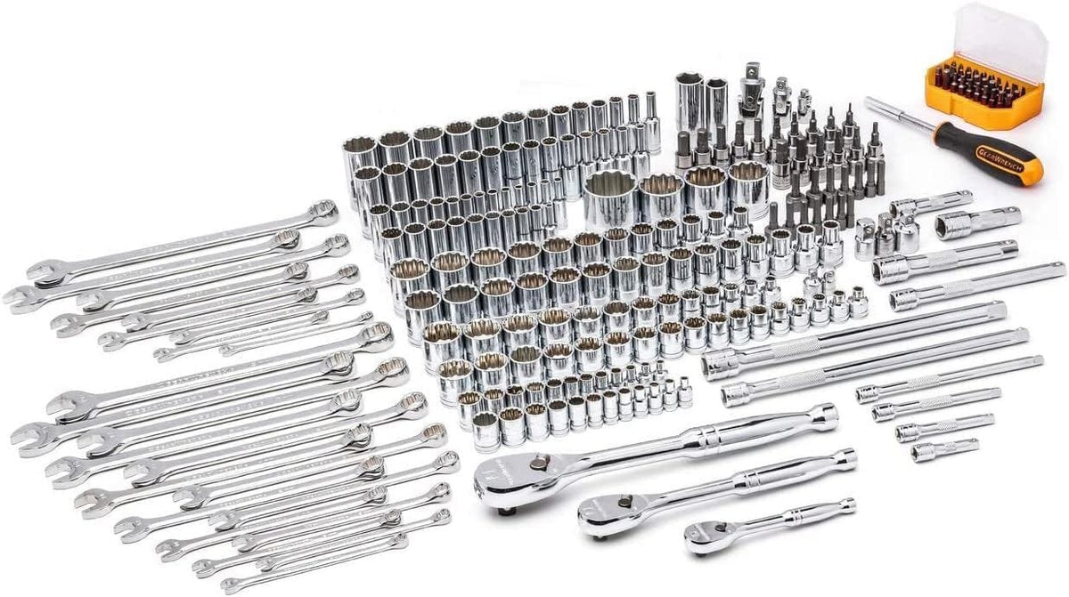 A studio shot of the complete 243-piece GEARWRENCH mechanics tool set, including all ratchets, wrenches, sockets, bits, and extensions, laid out without the box.