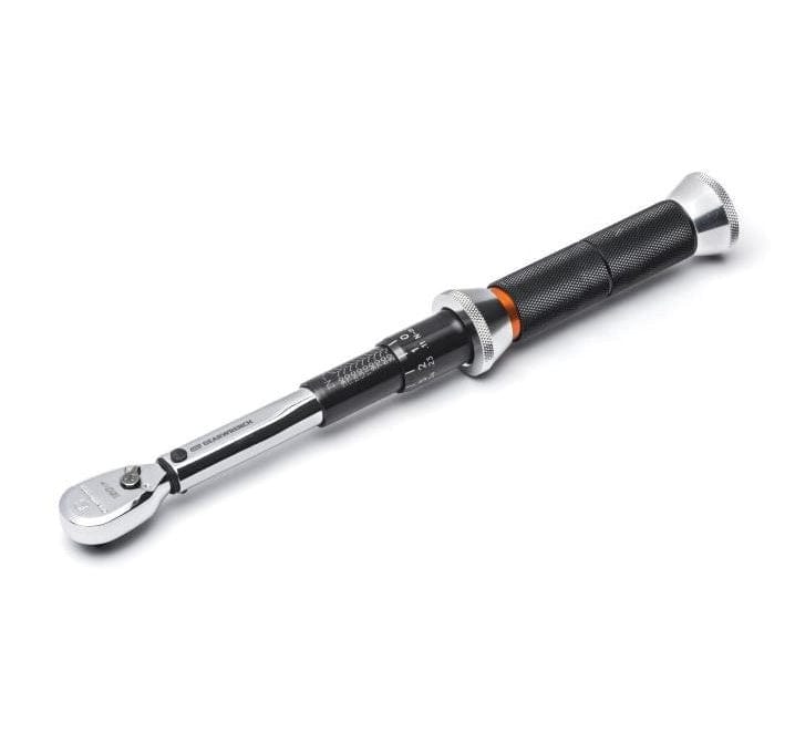Torque wrench with ratcheting head and knurled grip; visible scale for setting torque values in mechanical applications.
