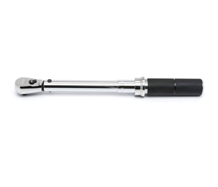 Torque wrench with polished finish and knurled handle, used for accurate fastening in automotive and industrial work.