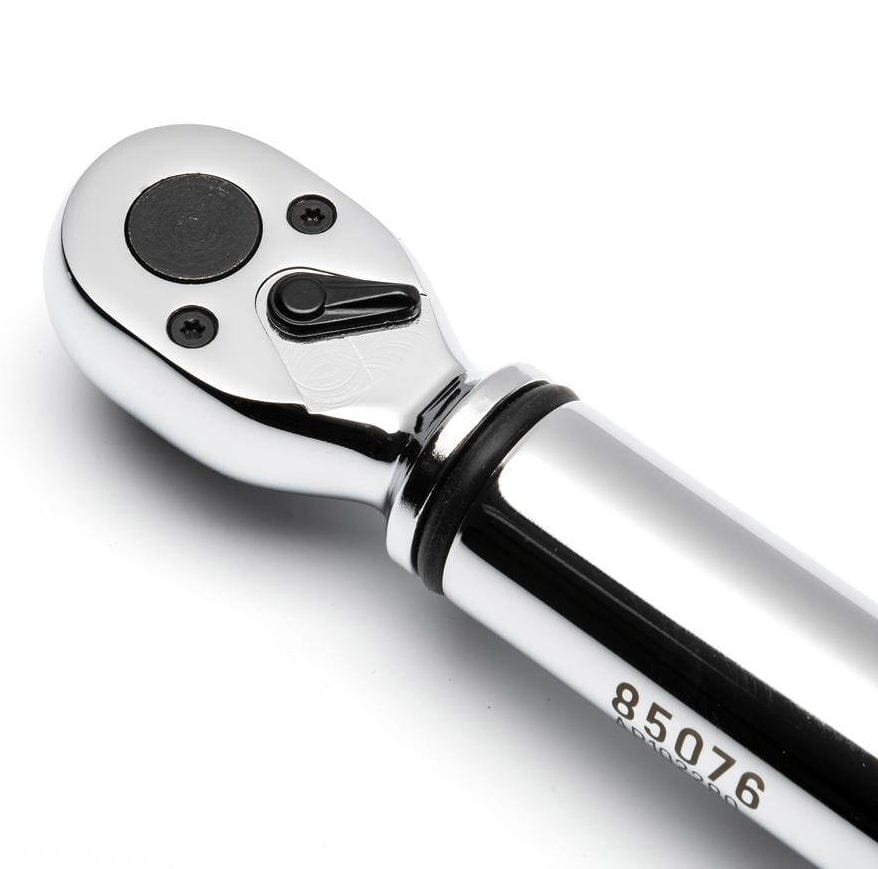 Close-up of ratchet wrench head with directional switch and engraved model number “85076” on chrome handle.