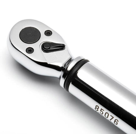 Close-up of ratchet wrench head with directional switch and engraved model number “85076” on chrome handle.