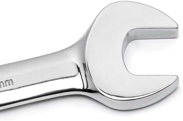 Close-up view of the polished chrome open end jaw of a combination wrench.
