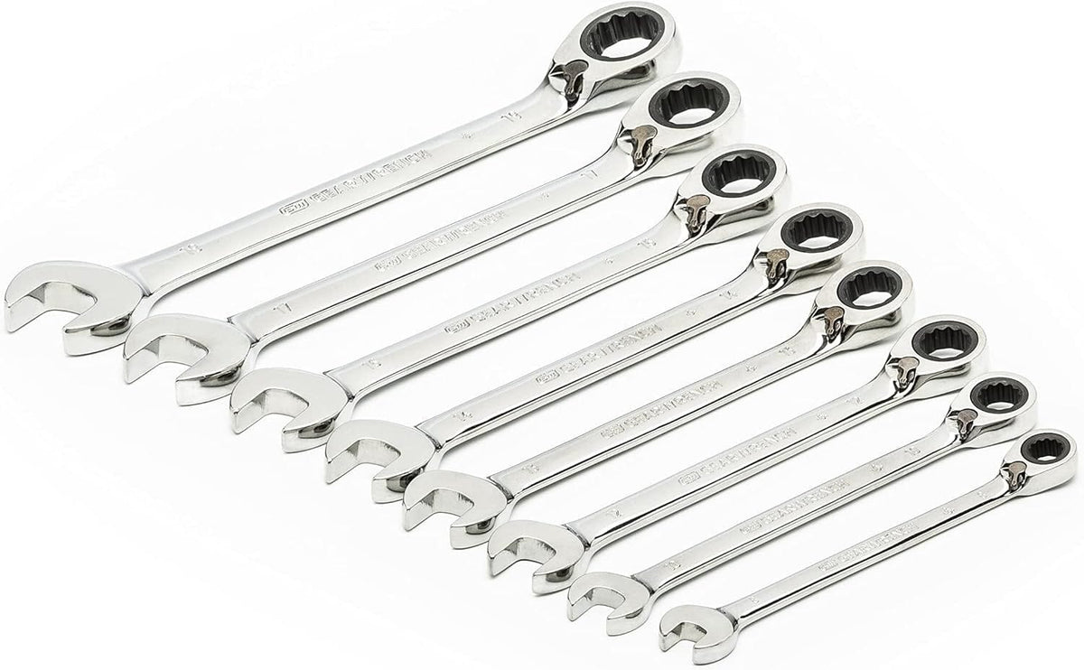 Eight polished chrome reversible ratcheting combination wrenches arranged diagonally to display the box ends with reversing levers.
