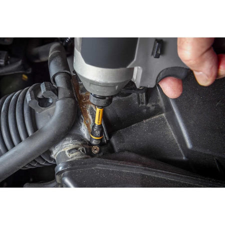 Mechanic removing a corroded 11mm air intake fastener in a crowded automotive engine bay with a compact Bolt Biter driver.