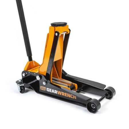 Gearwrench floor jack with black and orange body, long handle, and four wheels; lifting pad at top center.