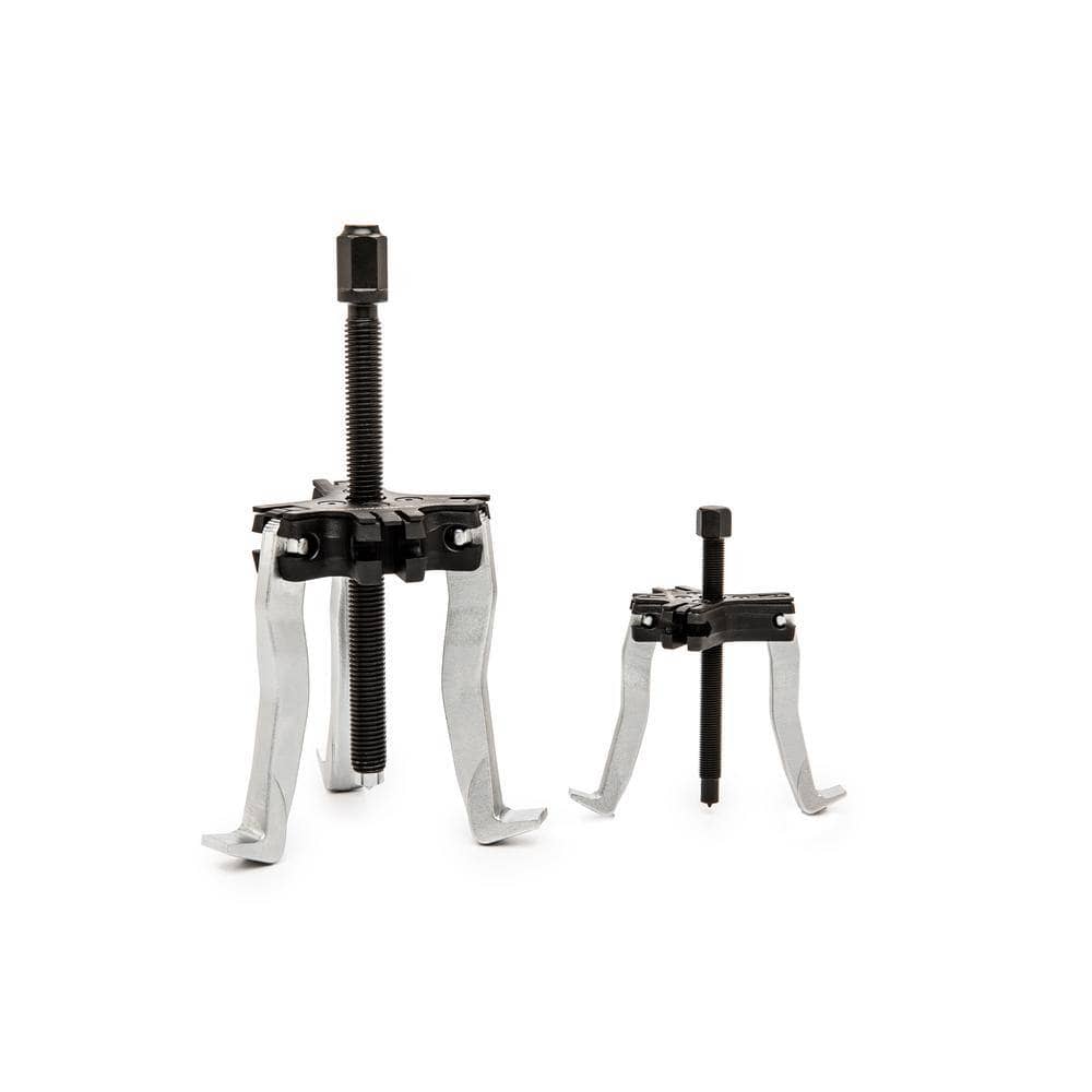 The 2-ton and 5-ton ratcheting pullers from the Gearwrench 3627 set displayed in 3-jaw and 2-jaw configurations, illustrating the versatility of the reversible jaw design for internal and external automotive removal.