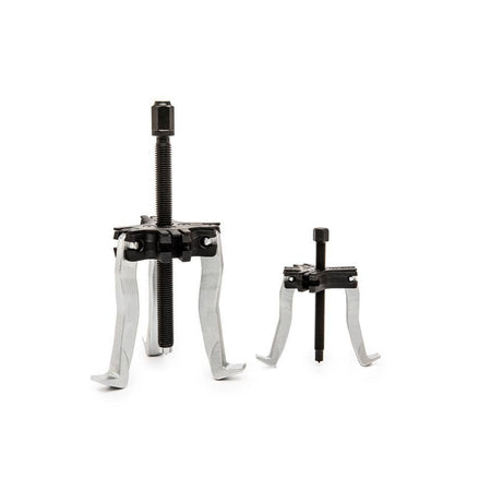 The 2-ton and 5-ton ratcheting pullers from the Gearwrench 3627 set displayed in 3-jaw and 2-jaw configurations, illustrating the versatility of the reversible jaw design for internal and external automotive removal.