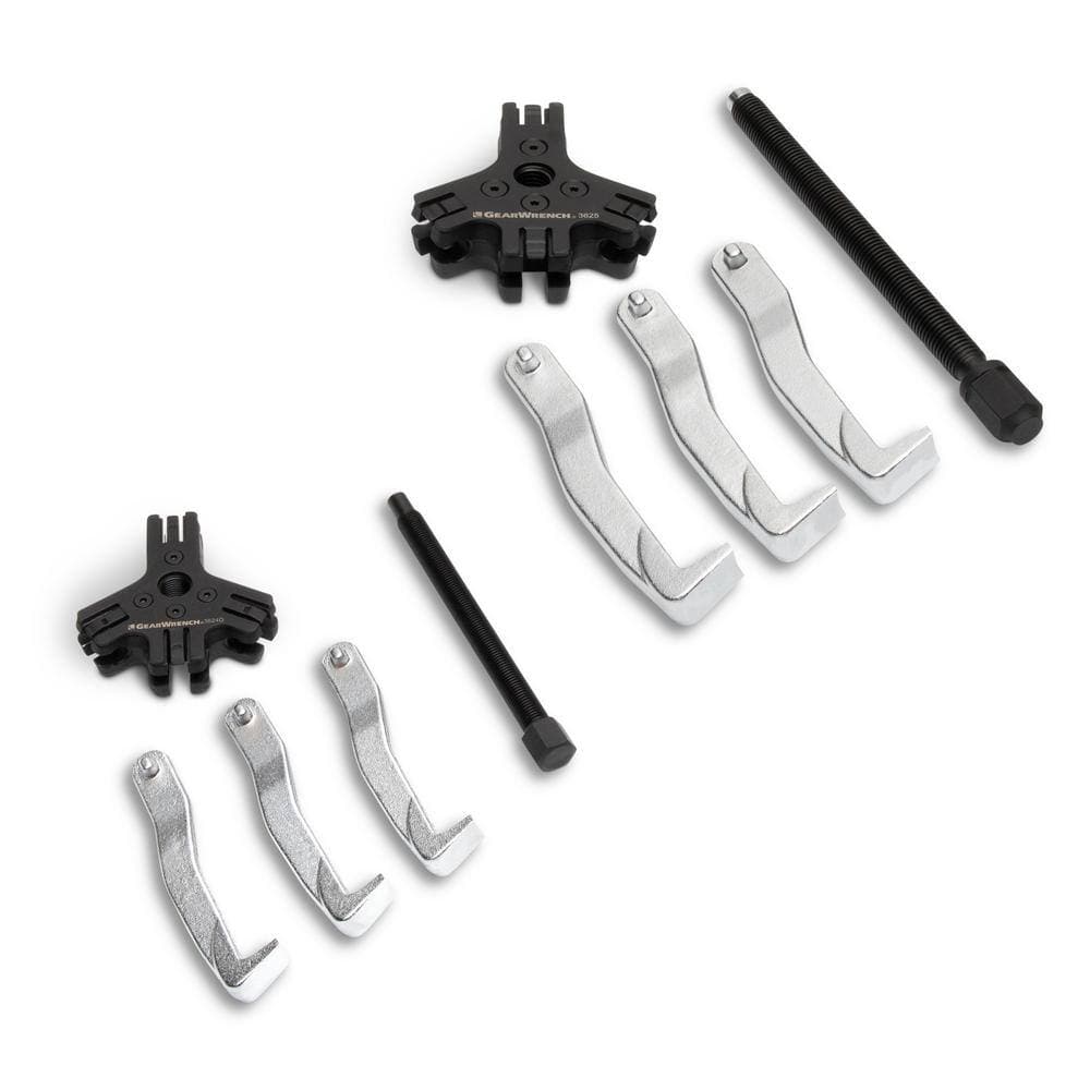 Overhead view of the Gearwrench 3627 set components disassembled, including two indexing heads, six high-strength pulling legs, and two drive screws for professional bearing and pulley maintenance.