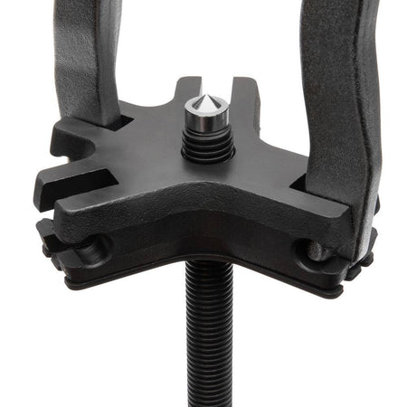Close-up detail of the Gearwrench ratcheting puller indexing head and center drive screw, highlighting the precision-engineered threads and the locking mechanism that keeps legs securely in place during operation.