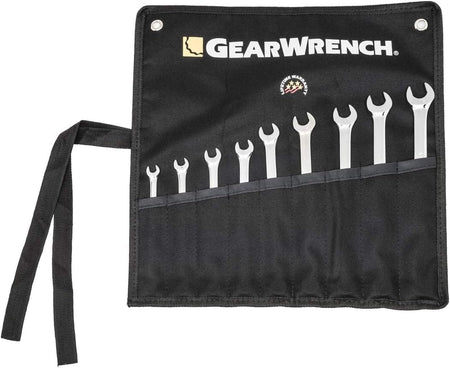 An overhead shot of the black canvas tool storage roll laid flat, showing how the staggered tool pockets hold the nine metric wrenches securely for transit.