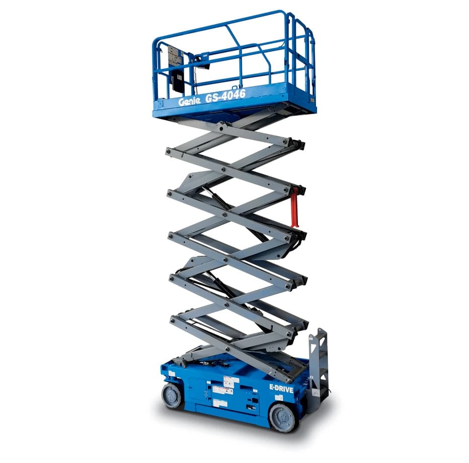 Genie GS-4046 scissor lift. You can clearly see the "Genie GS-4046" model name on the side of the platform. It's an electric-powered scissor lift, indicated by the "E-Drive" label on the base. These lifts are commonly used for providing elevated work platforms in various construction and maintenance applications. Given that we're in Tomball, you might see these being used at job sites around the area. Is there anything specific you'd like to know about this Genie model?
