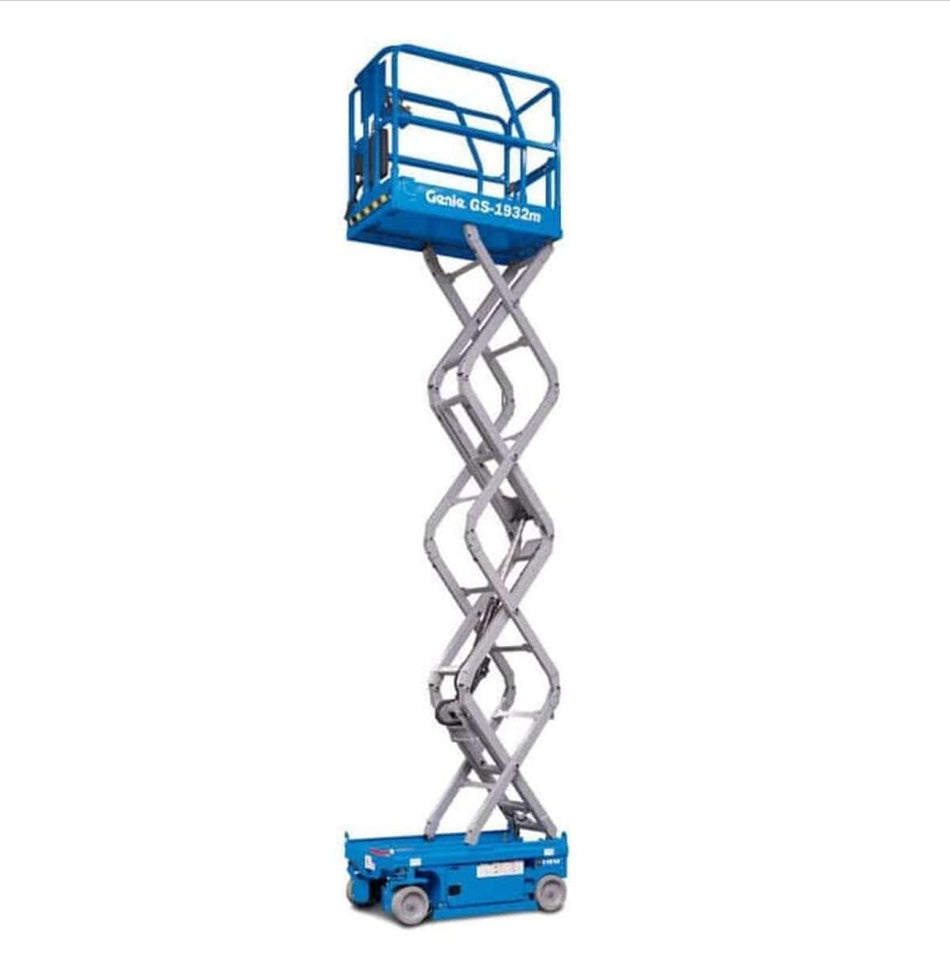 Genie GS-1932M scissor lift shown in extended position with crisscrossing metal arms and guardrail platform. The electric-powered lift is designed for safe elevation in industrial or construction settings, with the model name clearly visible on the side.