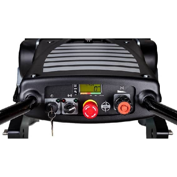 Close up view of the operator control panel featuring a digital display, red emergency stop button, and ignition key switch.