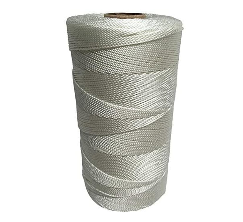 Close-up of a large spool of thick, white #18 twisted nylon seine twine for chalk lines and masonry use, showing the strong, braided texture of the 1000-foot cord.