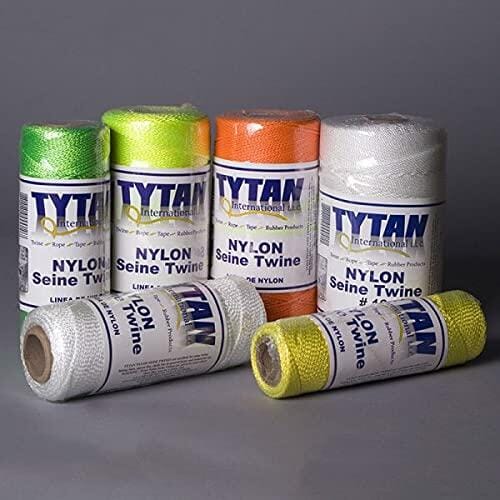 Assortment of TYTAN INTERNATIONAL LLC Nylon Seine Twine spools in various bright colors, including green, yellow, orange, and white, demonstrating the product line's range and utility for chalk lines and contractor layout work.