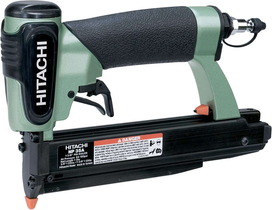 A three-quarter angle studio shot of the green and black Hitachi NP35A 23-gauge pin nailer, showing the specification label on the magazine.