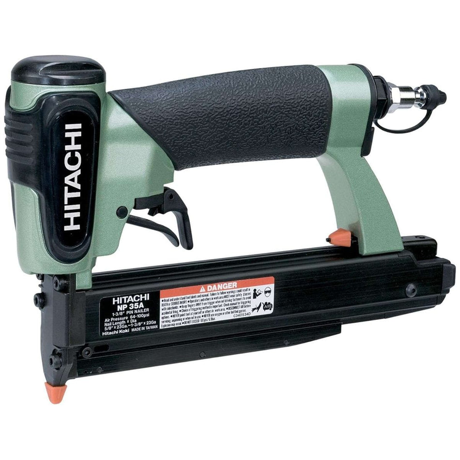 A three-quarter angle studio shot of the green and black Hitachi NP35A 23-gauge pin nailer, showing the specification label on the magazine.