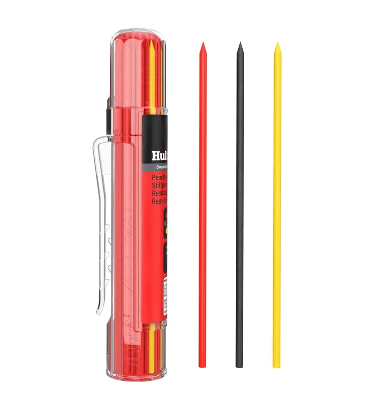A studio product photograph of the Hultafors HRD GRY refill container standing vertically next to three individual leads in red, graphite, and yellow, illustrating the variety of marking materials included in the pack.