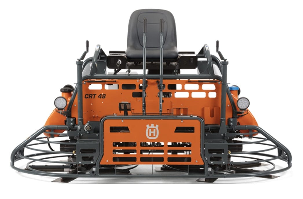 Husqvarna CRT 48 ride-on concrete trowel with dual levers, protective blade guards, and visible model branding.