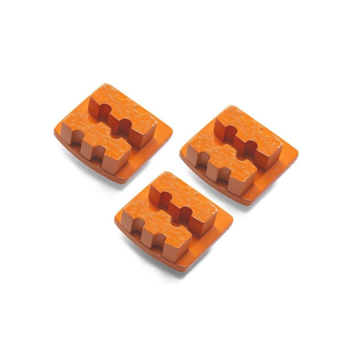 Three orange Husqvarna double-segment diamond grinding tools with interlocking raised pads on rectangular bases; designed for hard concrete polishing and surface refinement