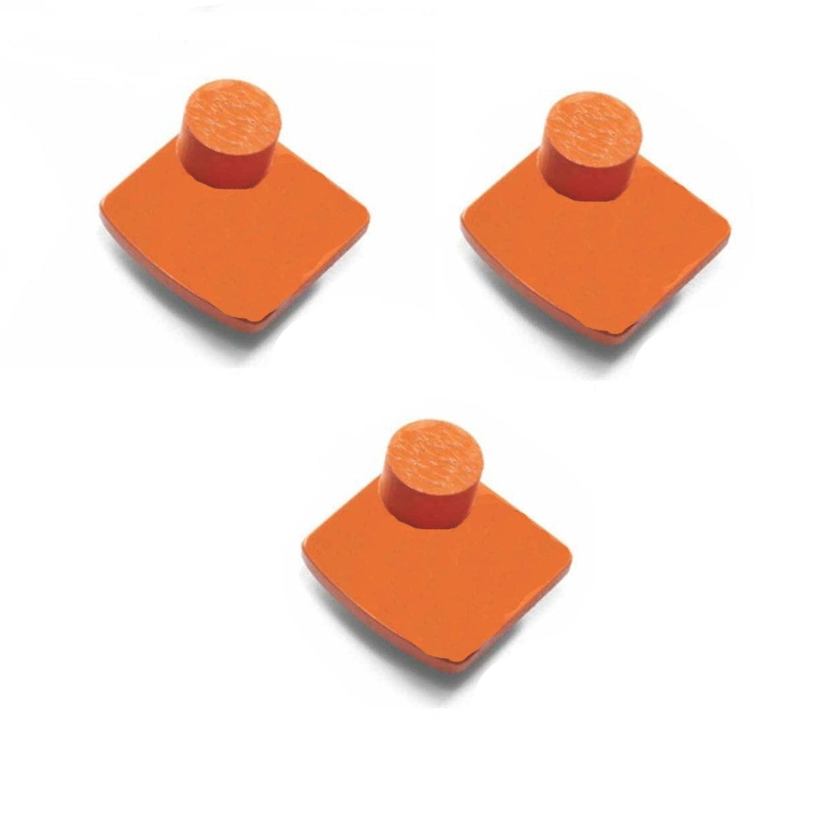 Three orange Husqvarna single-segment diamond grinding tools with cylindrical pegs on square bases; designed for hard concrete polishing.