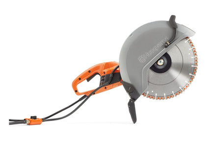 Husqvarna handheld electric cut-off saw with segmented blade and ergonomic handle for cutting masonry or concrete.