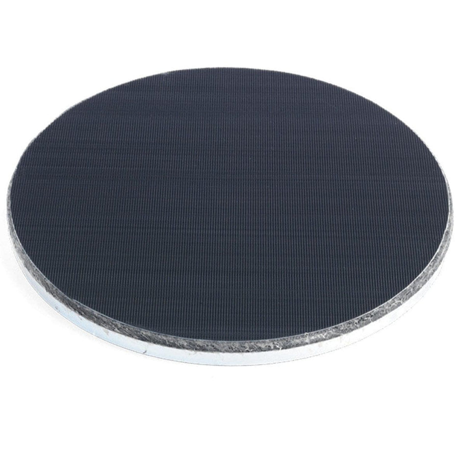 Circular Husqvarna resin holder plate with dark textured surface and metallic edge; designed for Velcro-backed polishing pad attachment in concrete grinding systems.