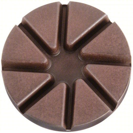 Segmented copper resin matrix face on a Husqvarna 100-grit pad engineered to remove metal scratches during concrete surface prep.