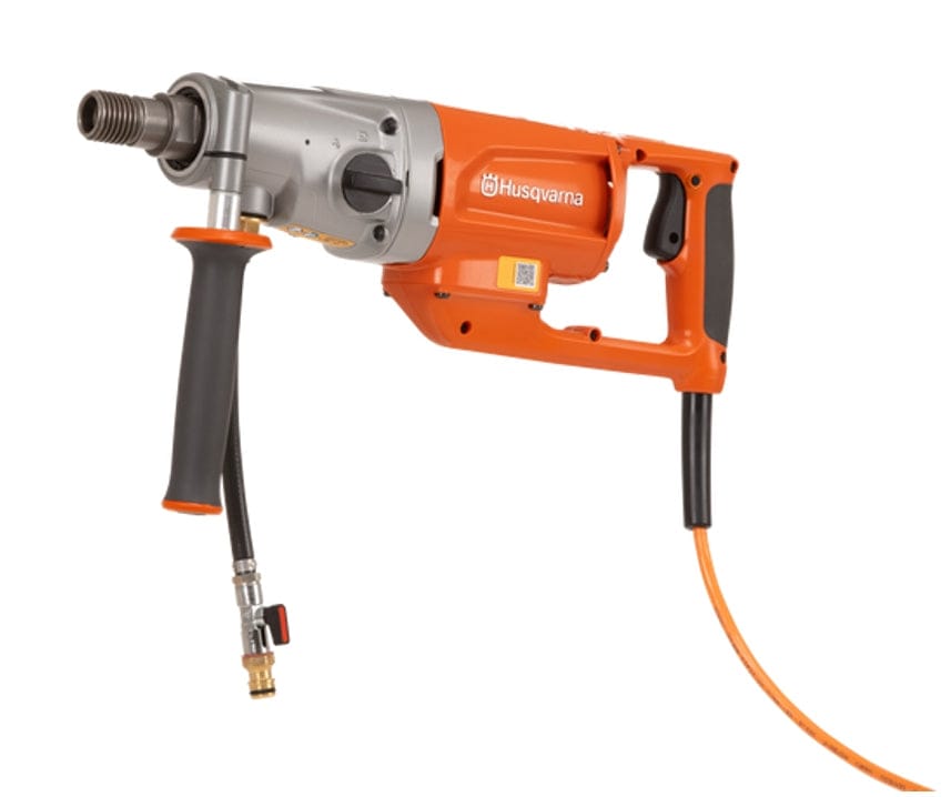 A studio product photograph of the Husqvarna DM 200 Handheld Core Drill highlighting its ergonomic orange and silver design, adjustable side handle, and water valve attachment for professional wet coring.