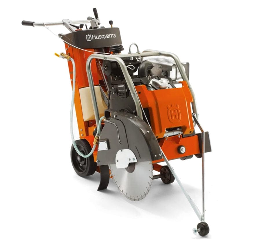 Walk-behind Husqvarna concrete floor saw with front-mounted 20-inch diamond blade, Honda gas engine, and water hose attachment. Designed for cutting concrete or asphalt with manual handles and wheeled mobility.