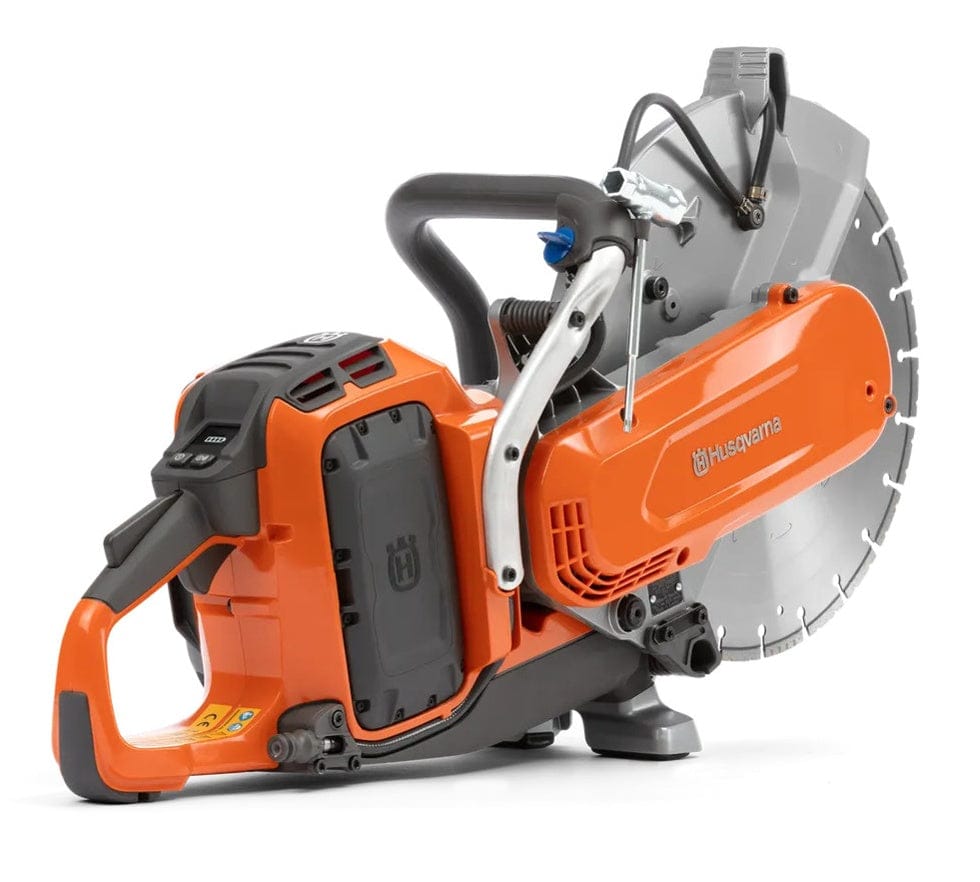 A rear-angle view of the Husqvarna K1 PACE saw showing the battery compartment with a B380X battery inserted and the ergonomic rear handle with integrated power triggers.