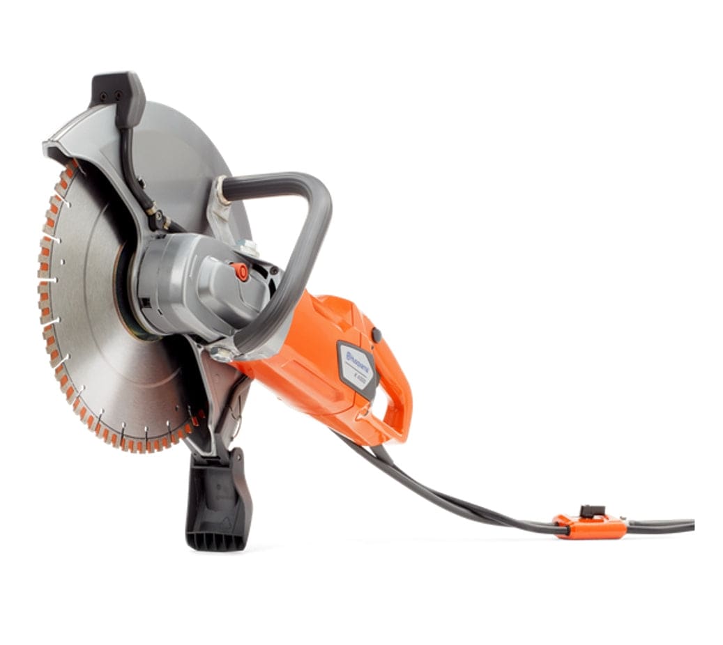Angled view of the Husqvarna K4000 electric power cutter with a diamond blade, showing the ergonomic rear handle and the front handle configuration.