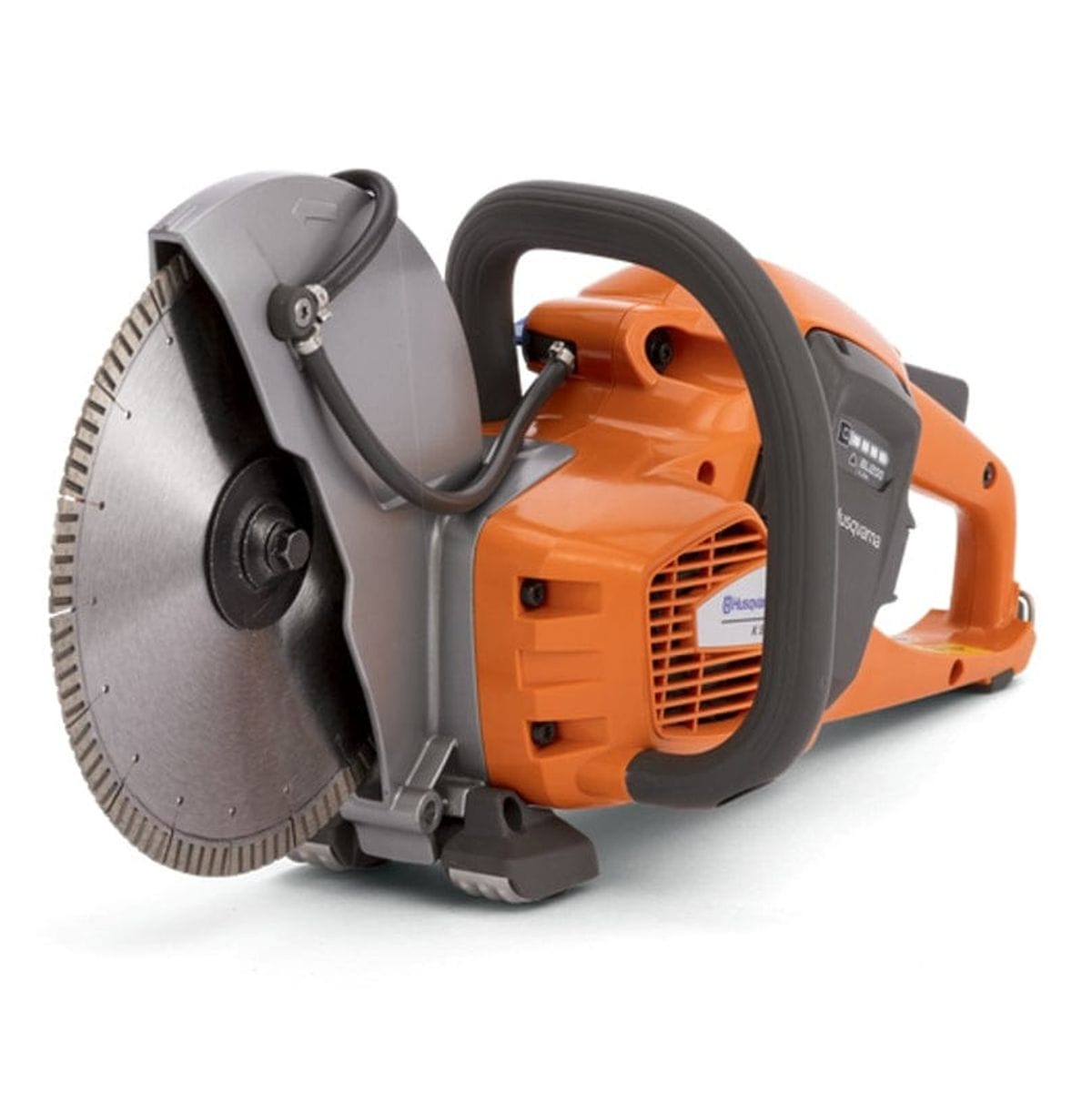 Angled view of the Husqvarna K535i cordless cut-off saw with a diamond blade, emphasizing the compact, balanced design. The water feed tubes are visible on the gray blade guard.