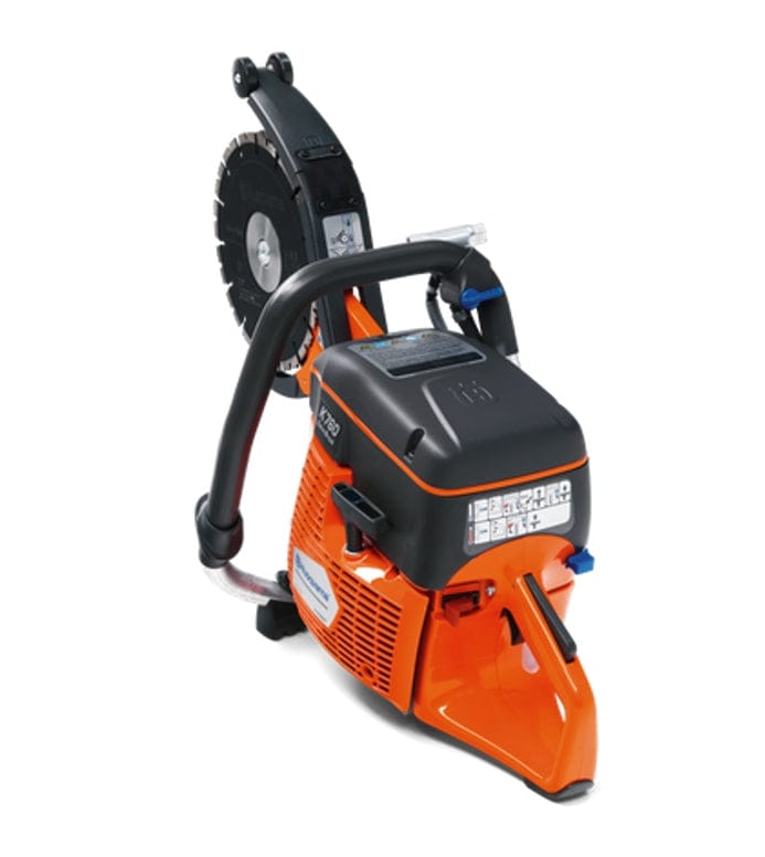 A top-down angled studio photograph of the Husqvarna K760 Cut-n-Break II highlighting the ergonomic top handle and the streamlined orange and black motor casing.