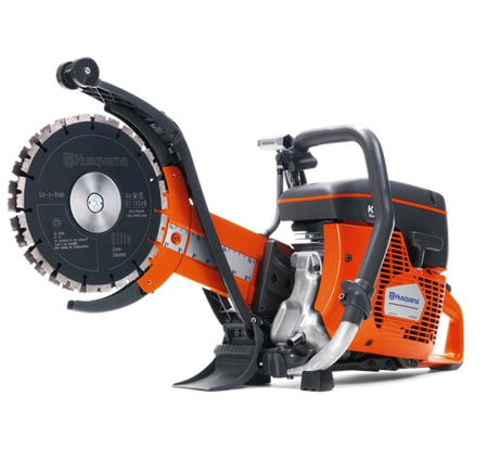 An angled side-view studio photograph of the Husqvarna K760 Cut-n-Break II showcasing the twin-blade system and the robust handle for stable operation.