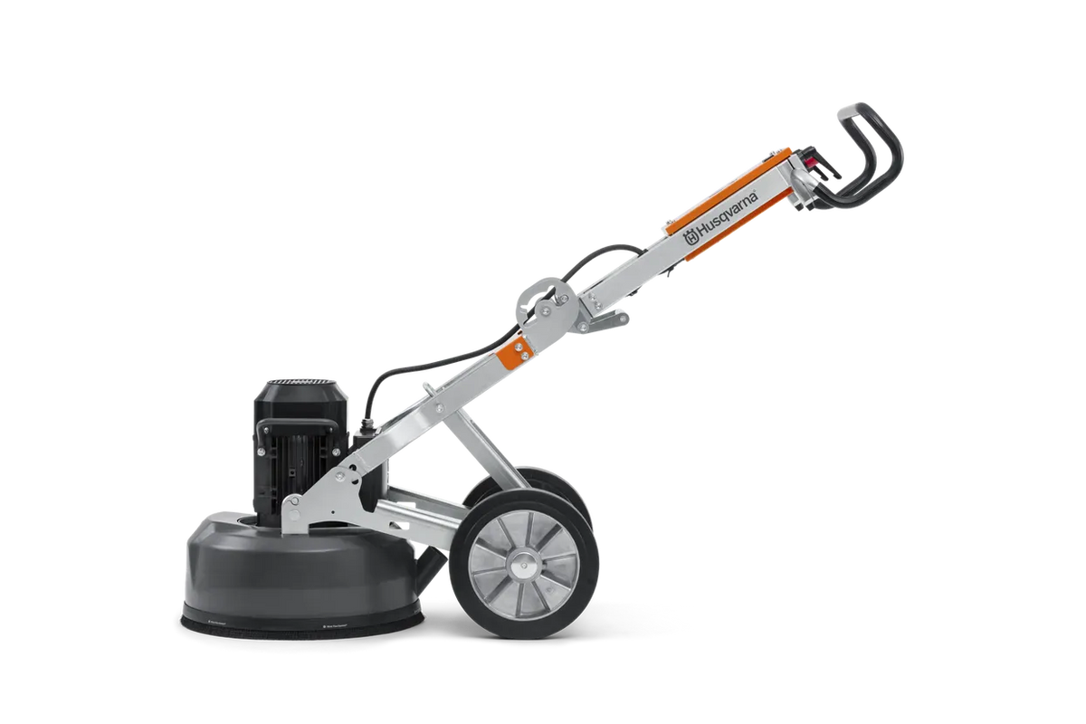 Full side view of the Husqvarna PG 450 concrete polisher in a neutral position, displaying the balance between the heavy-duty grinding head and the maneuverable wheeled frame.