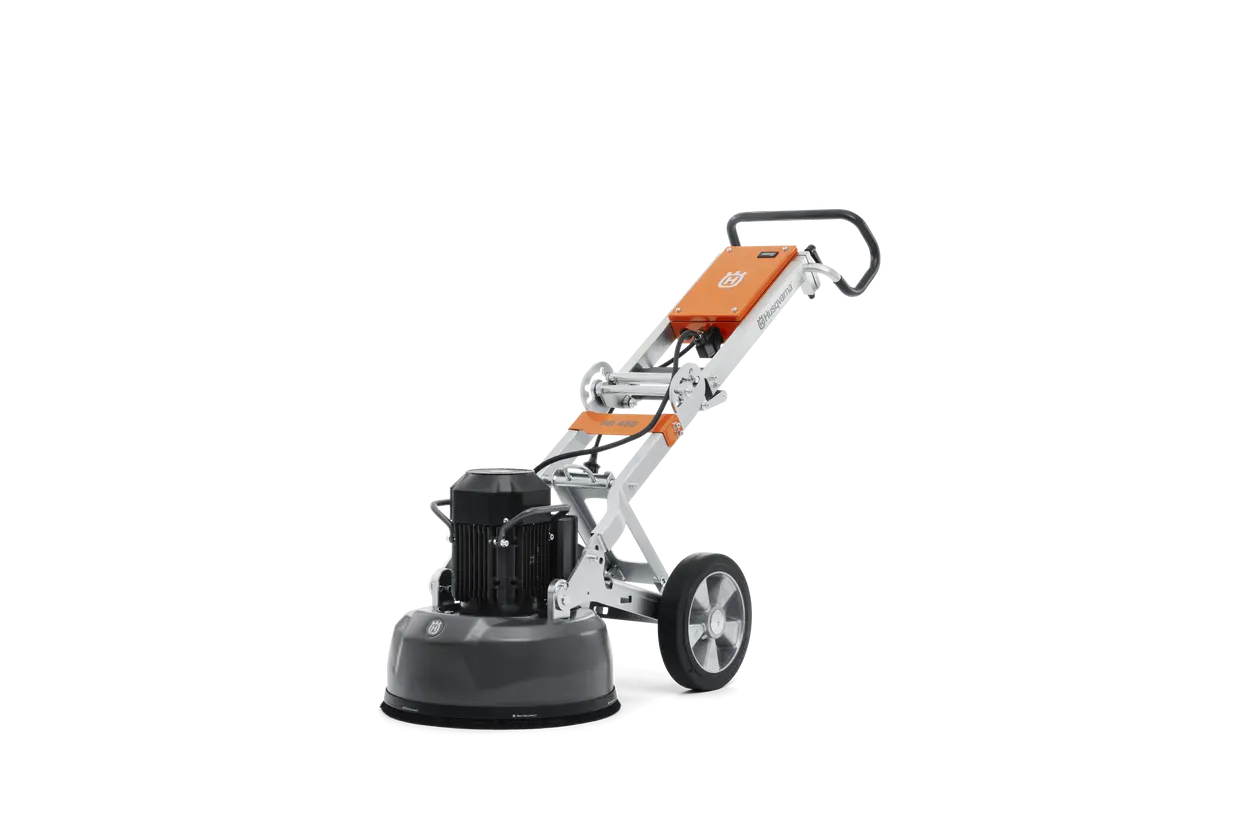 Rear three-quarter view of the Husqvarna PG 450 planetary floor grinder, showcasing the brush skirt and floating cover designed for effective dust management during concrete grinding.