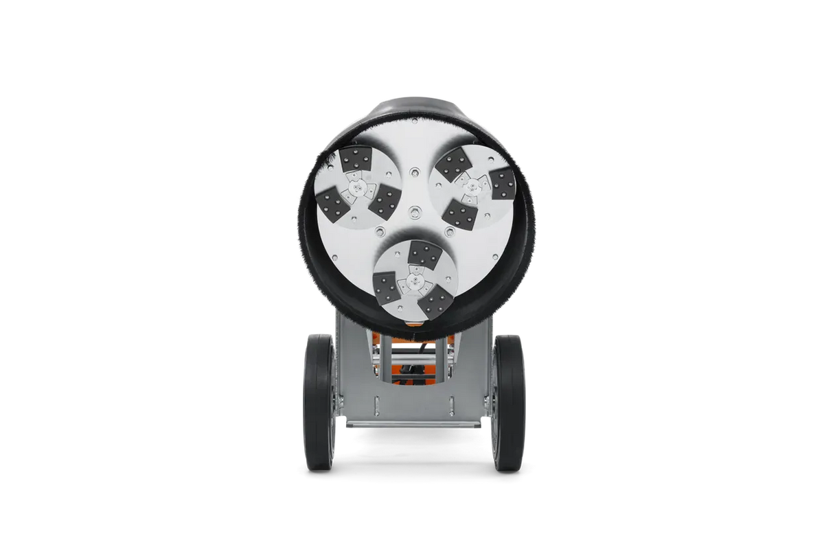 Bottom-up view of the Husqvarna PG 450 grinding head, revealing the three planetary discs equipped with the EZchange system for rapid diamond tooling swaps.
