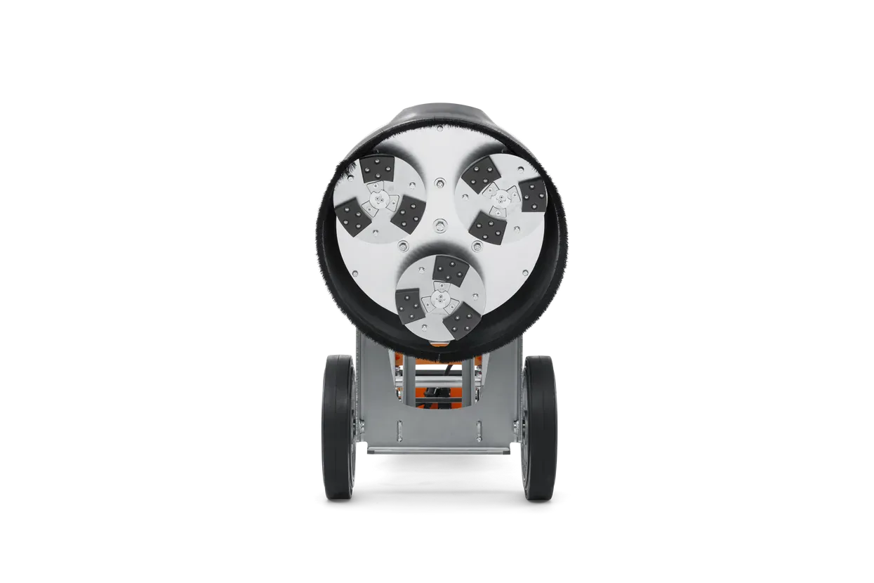 Bottom-up view of the Husqvarna PG 450 grinding head, revealing the three planetary discs equipped with the EZchange system for rapid diamond tooling swaps.
