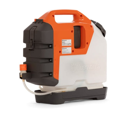 Rear angle view of the WT15i water tank displaying the dark gray pump housing, manufacturer specification labels, and the water hose connection point with an orange quick-connect fitting.