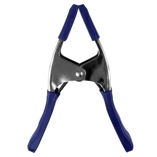 Front view studio shot of the IRWIN spring clamp closed, highlighting the non-marring blue soft grip pads that protect materials