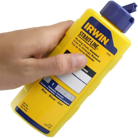 Handheld view of the IRWIN 64901 marking chalk bottle showing the blue flip-top cap designed for airtight storage and easy mess-free refilling of chalk reels on the jobsite.